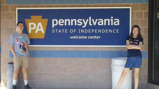 kids in front of Pennsylvania sign